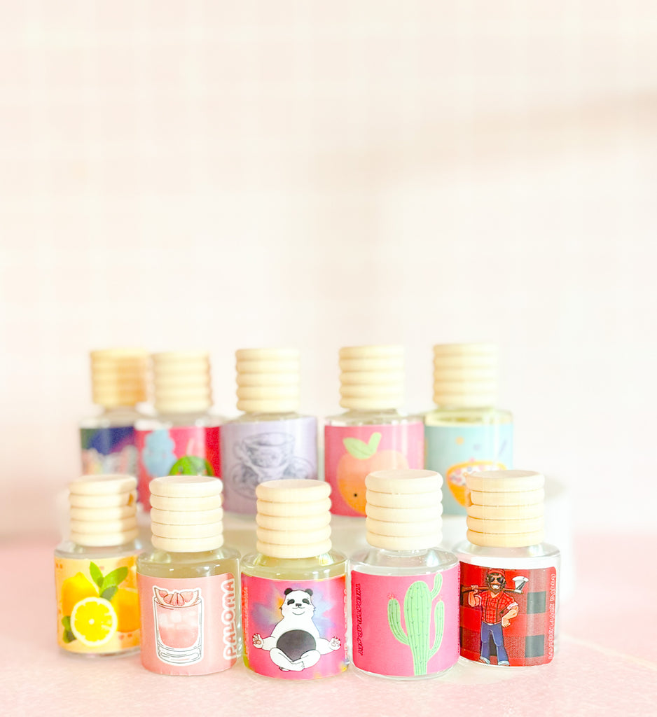 Colorful labeled car diffuser bottles handmade by The Bath Lab in Knoxville, TN